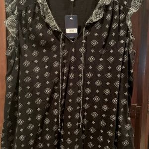 Black sleeveless top with ruffle trim at sleeve.  Cool and comfy